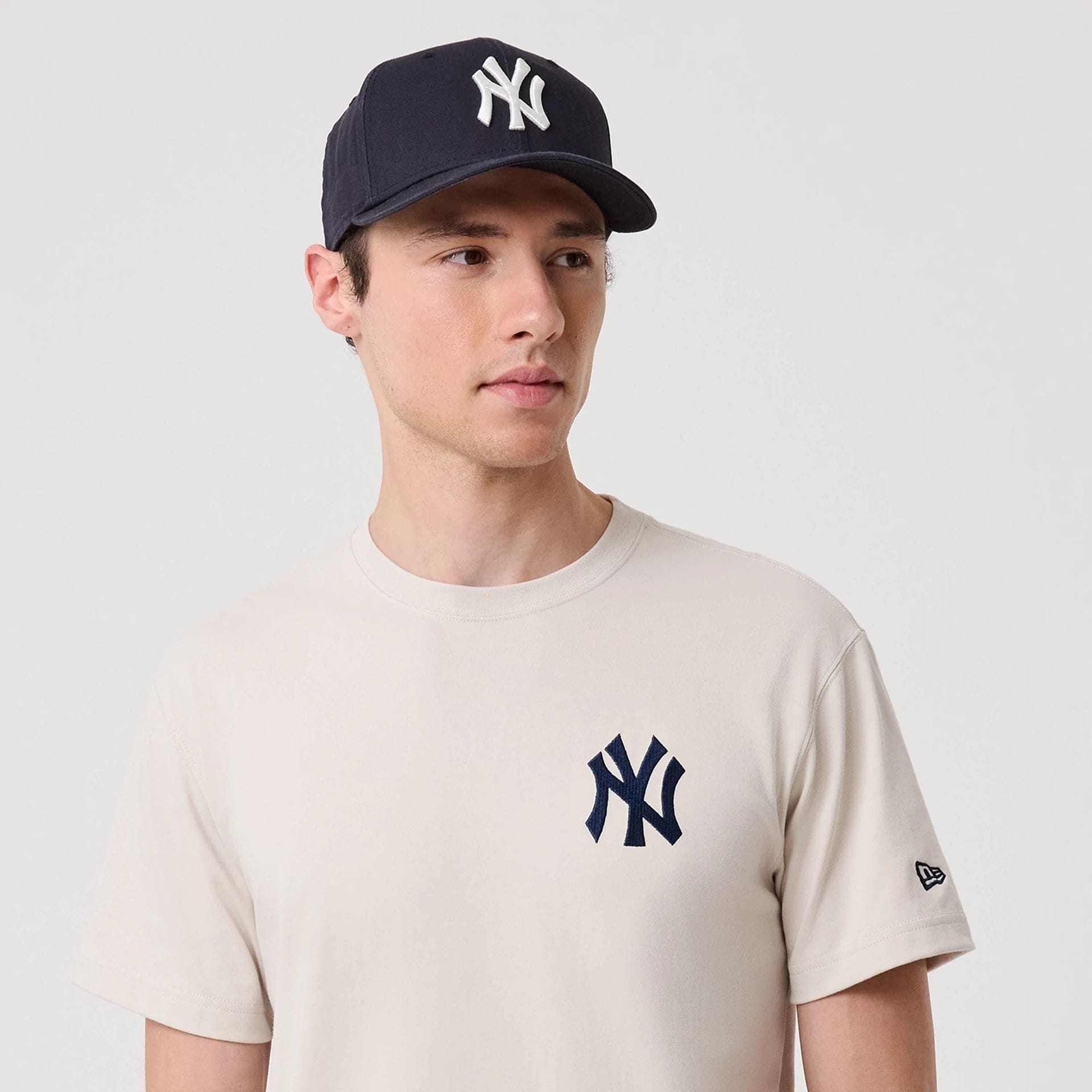 The model is wearing this MLB Banana Graphic New York Yankees T-Shirt in natural. 6