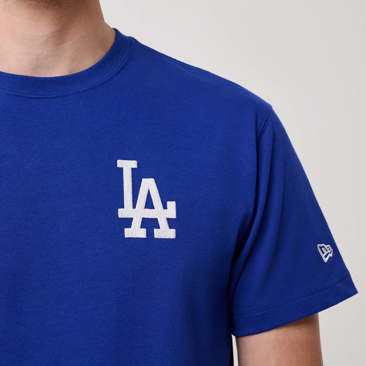 New Era LA Dodgers MLB Banana Graphic Bright Blue T-Shirt, front view showing a large white embroidered LA logo on the chest and a small white embroidered New Era logo on the sleeve.