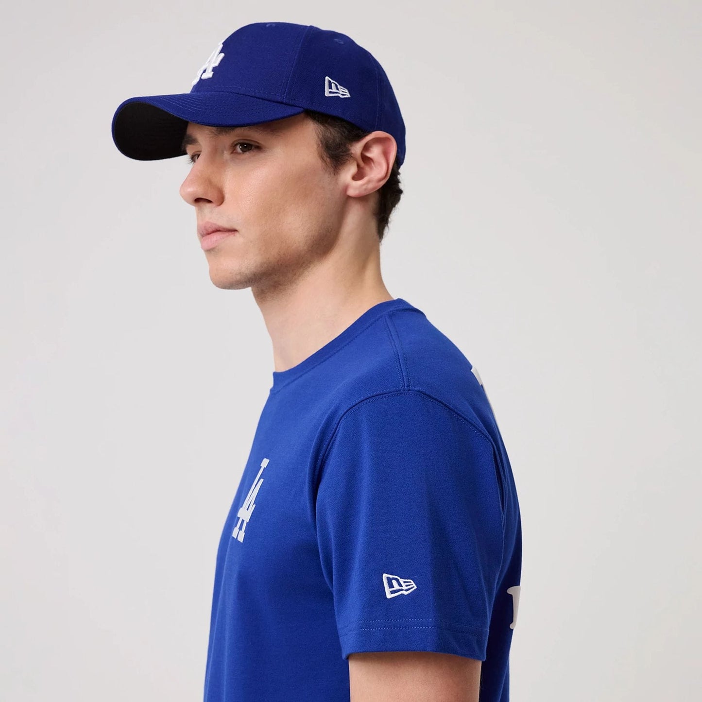 The model is wearing this MLB Banana Graphic LA Dodgers T-Shirt in bright blue. 4