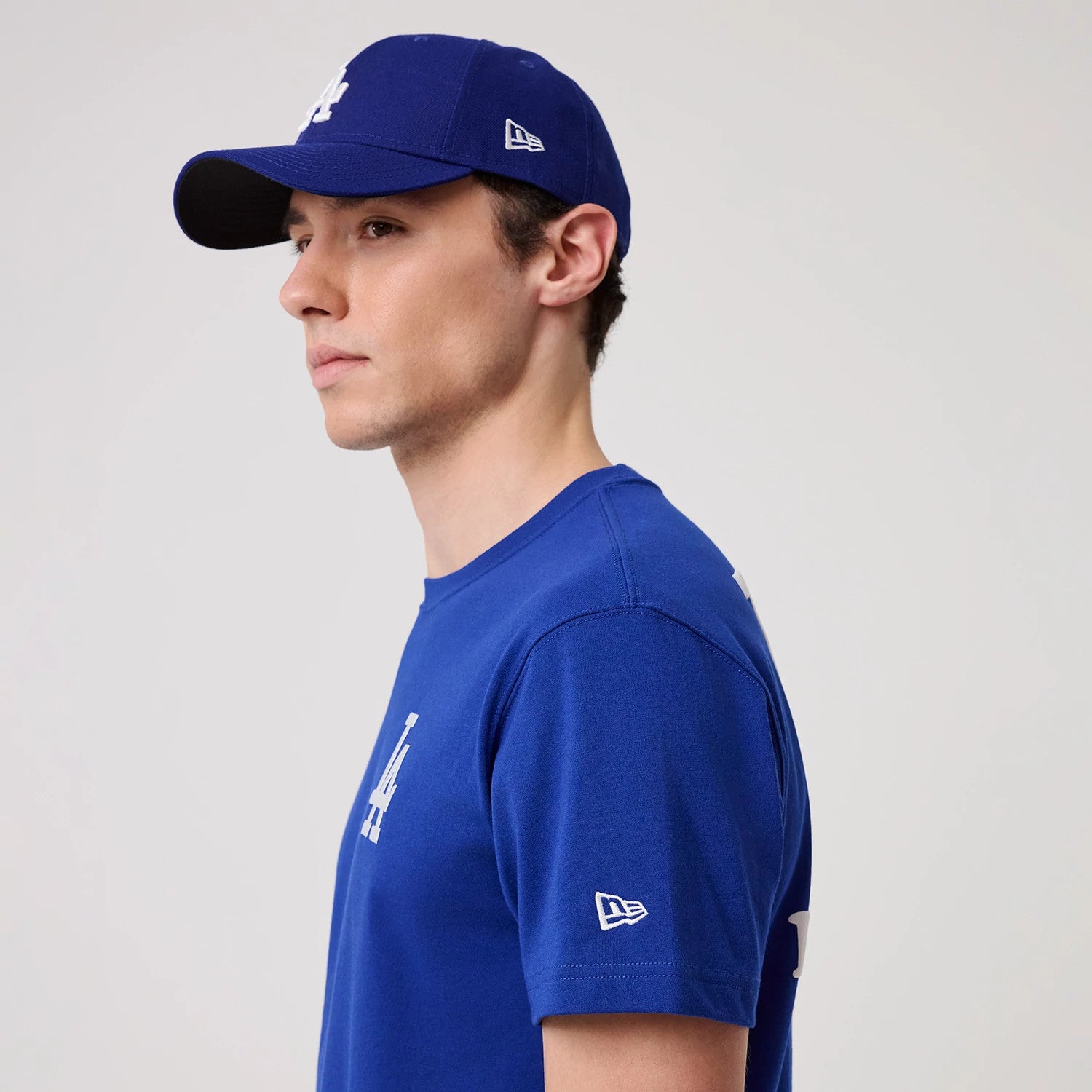 The model is wearing this MLB Banana Graphic LA Dodgers T-Shirt in bright blue. 4