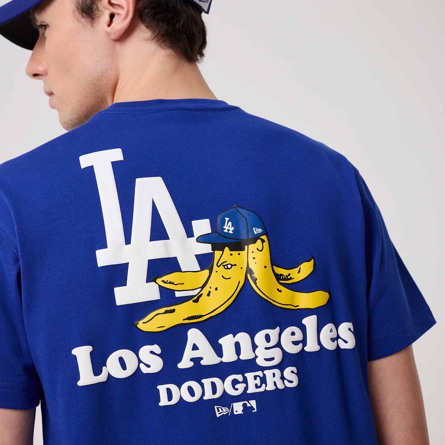 The model is wearing this MLB Banana Graphic LA Dodgers T-Shirt in bright blue. 3