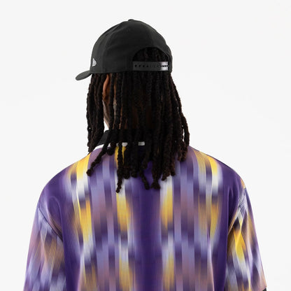The model is wearing this NBA LA Lakers Soccer Jersey in purple. 7