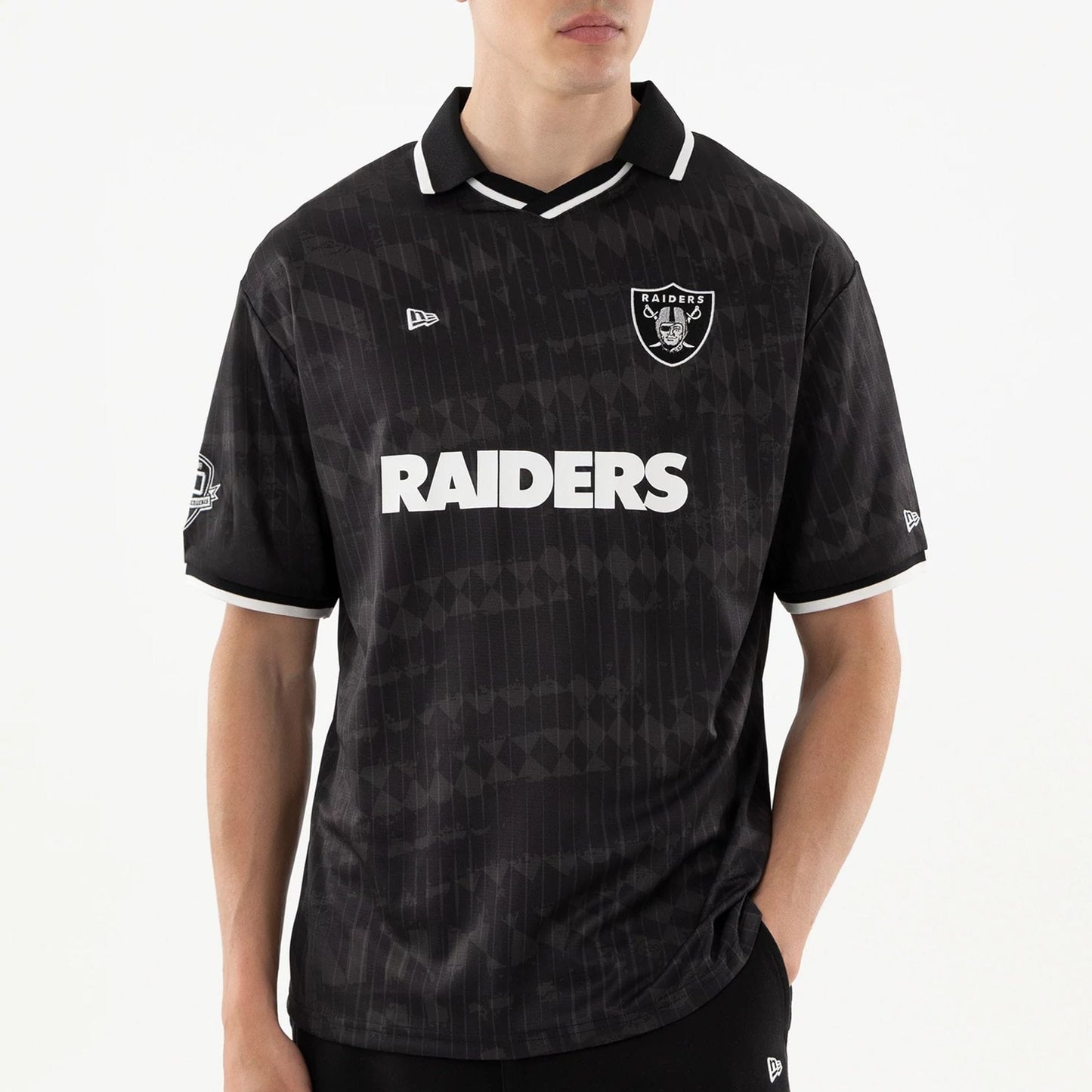 The model is wearing this NFL Las Vegas Raiders Soccer Jersey in black. 4
