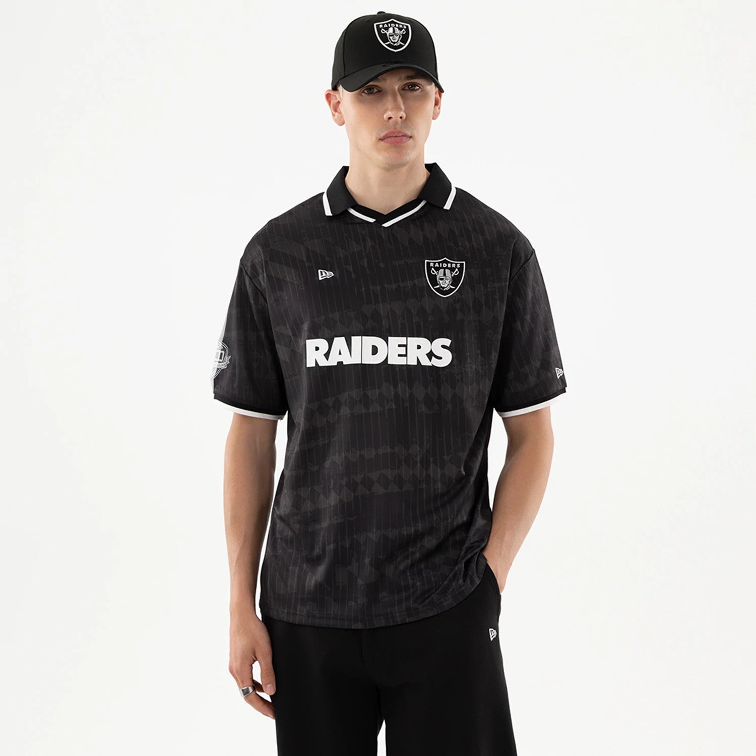 The model is wearing this NFL Las Vegas Raiders Soccer Jersey in black. 1