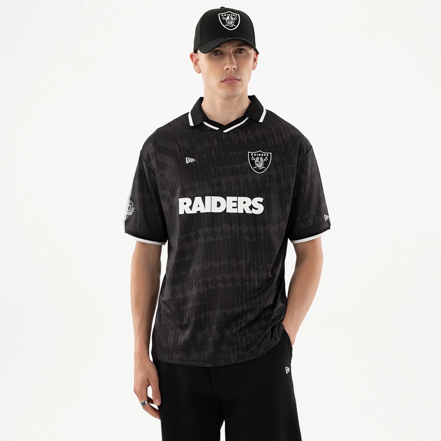 The model is wearing this NFL Las Vegas Raiders Soccer Jersey in black. 1