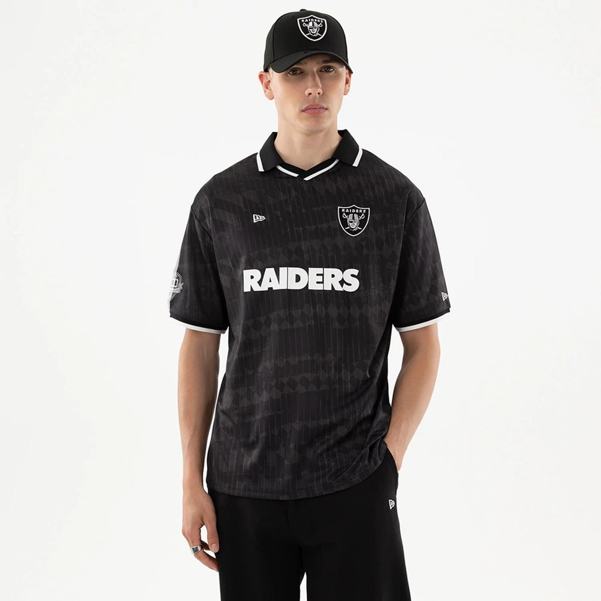 The model is wearing this NFL Las Vegas Raiders Soccer Jersey in black. 1