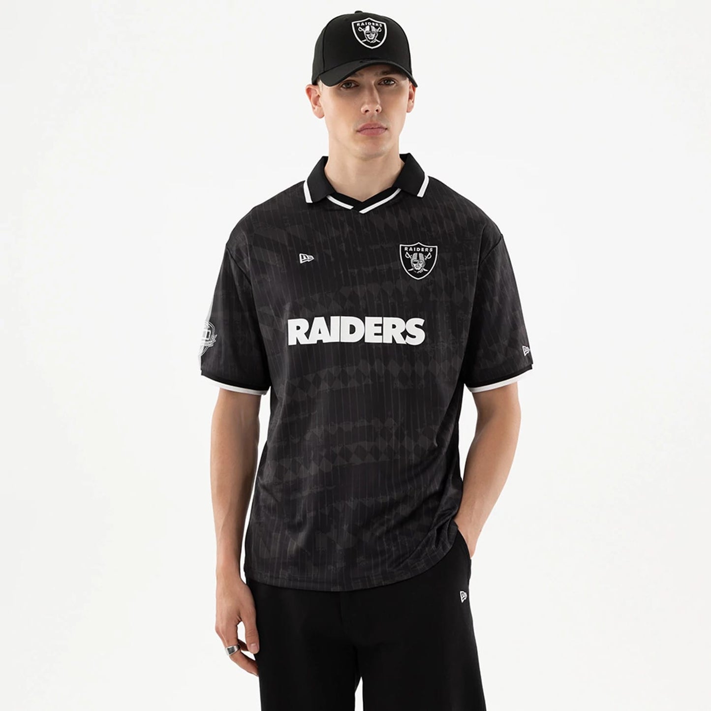 The model is wearing this NFL Las Vegas Raiders Soccer Jersey in black. 1