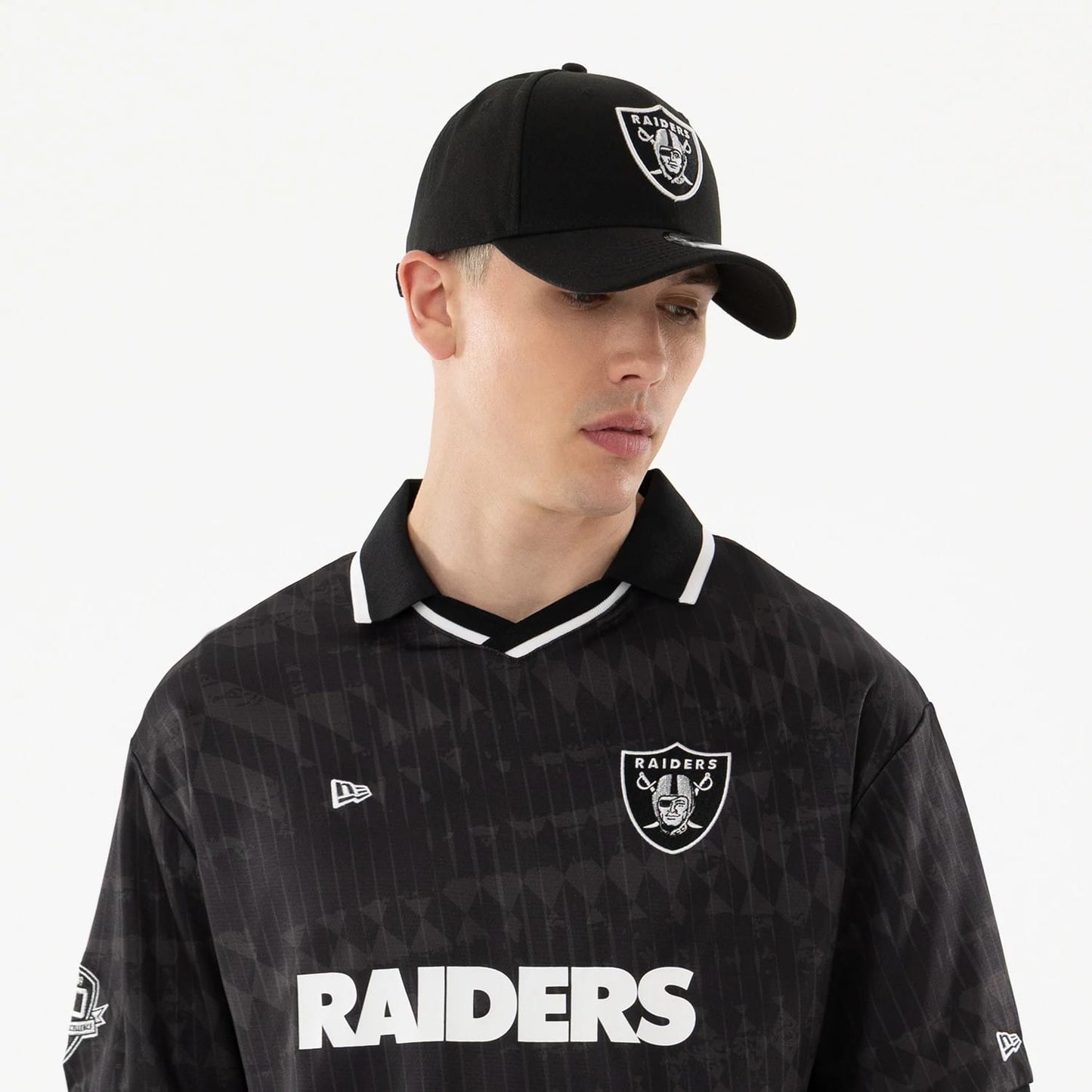 The model is wearing this NFL Las Vegas Raiders Soccer Jersey in black. 6