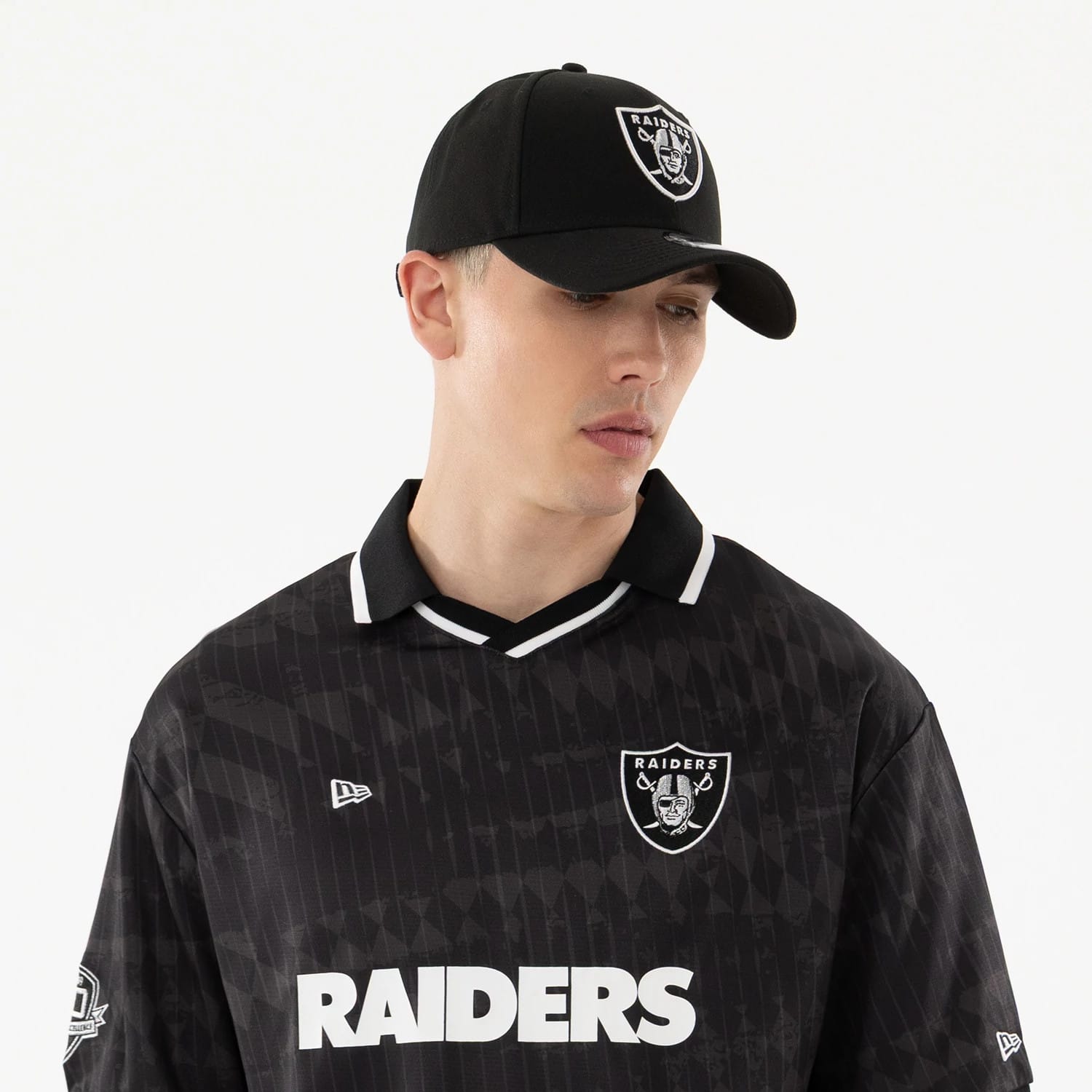 The model is wearing this NFL Las Vegas Raiders Soccer Jersey in black. 6
