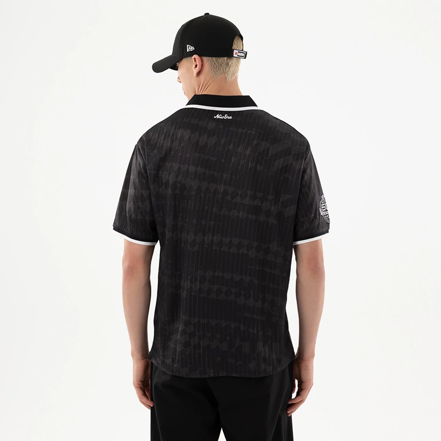 The model is wearing this NFL Las Vegas Raiders Soccer Jersey in black. 2