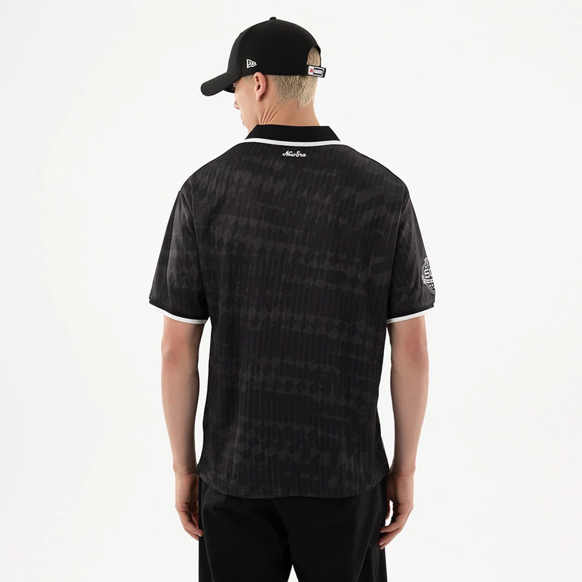 The model is wearing this NFL Las Vegas Raiders Soccer Jersey in black. 2