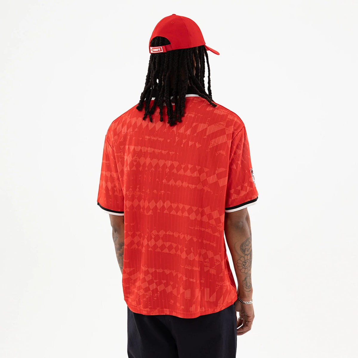 The model is wearing this NFL Kansas City Chiefs Soccer Jersey in red. 2
