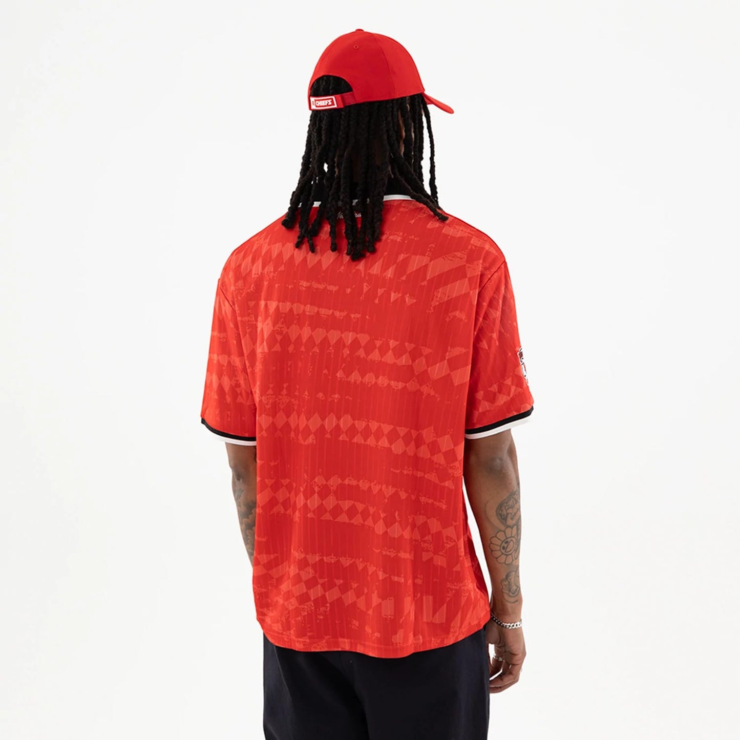 The model is wearing this NFL Kansas City Chiefs Soccer Jersey in red. 2