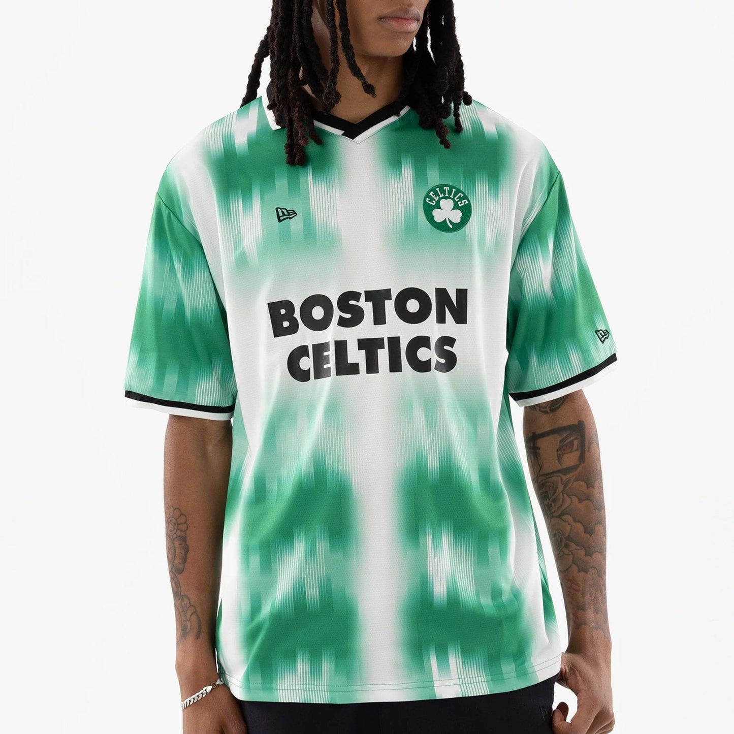 The model is wearing this NBA Boston Celtics Soccer Jersey in green. 3