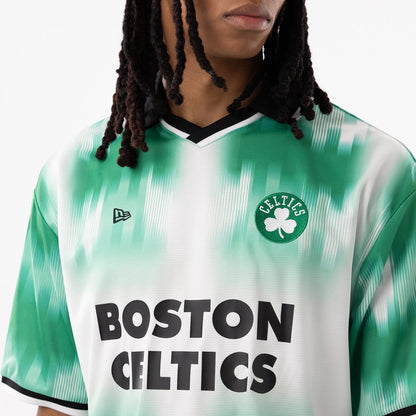 Boston Celtics NBA Green Soccer Jersey, front view on a model showing the Celtics cloverleaf patch on the left chest, black New Era flag logo on the right chest, and black lettering across the front.