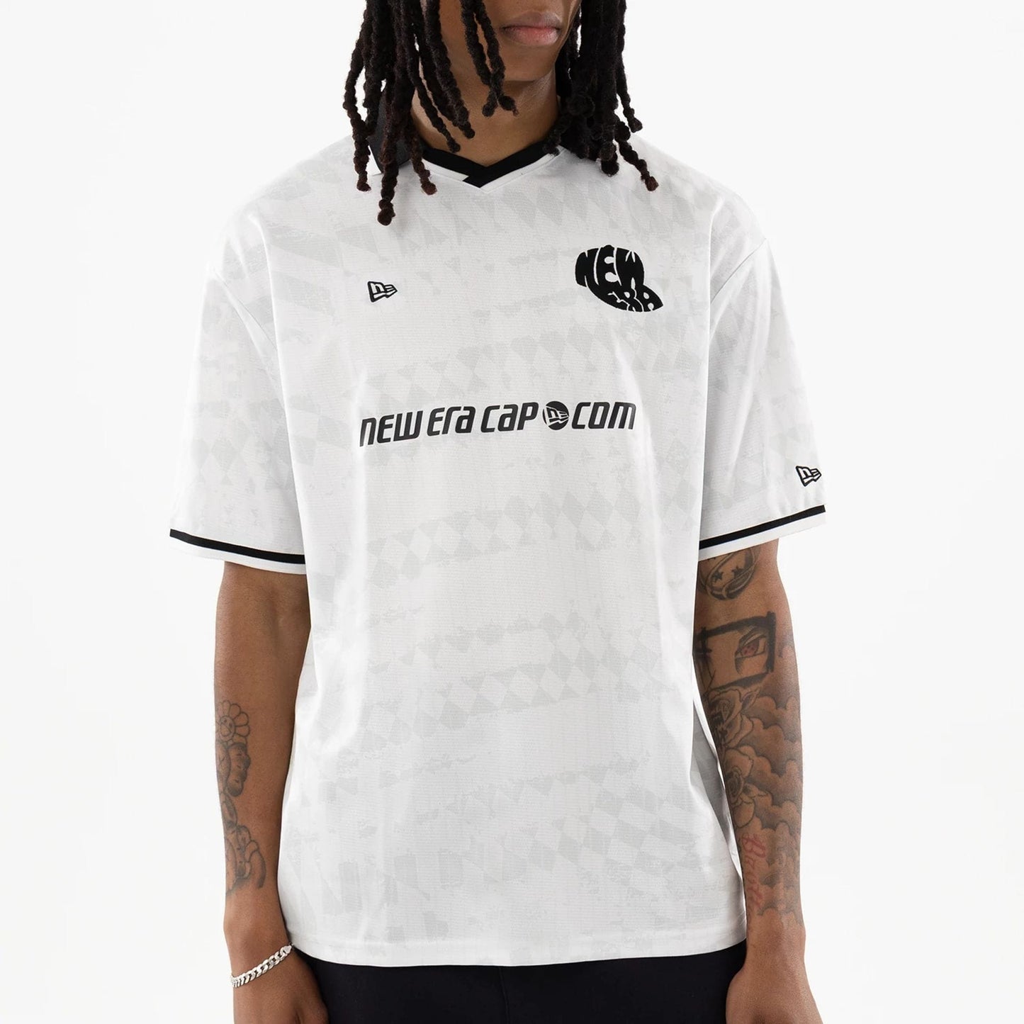The model is wearing this New Era Soccer Jersey in white. 3