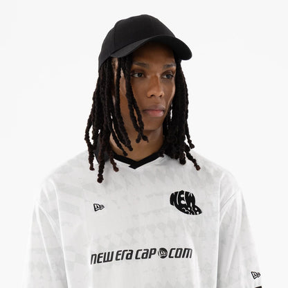 The model is wearing this New Era Soccer Jersey in white. 6