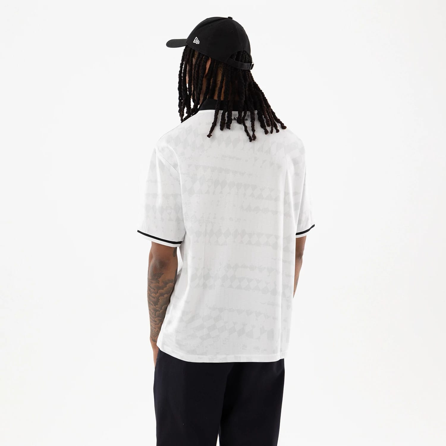 The model is wearing this New Era Soccer Jersey in white. 2