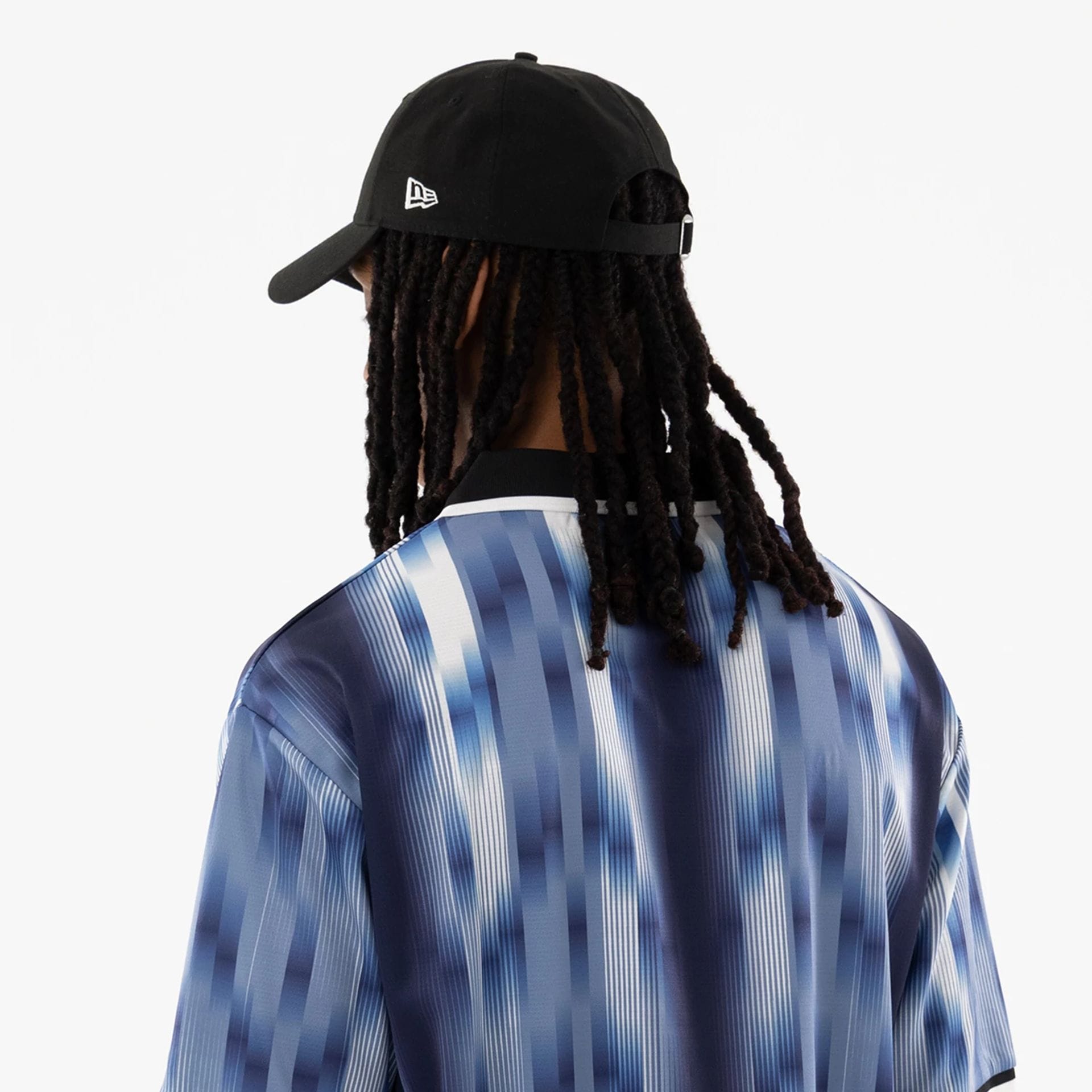 The model is wearing this New Era Soccer Jersey in navy. 6