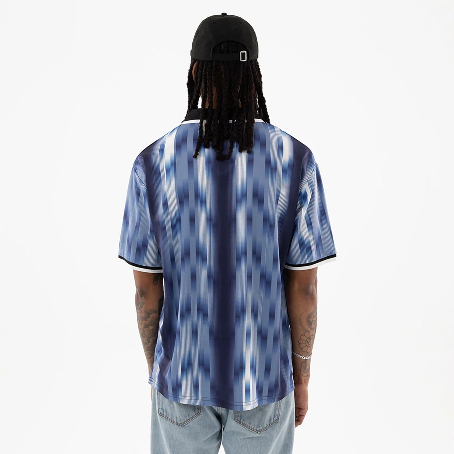 The model is wearing this New Era Soccer Jersey in navy. 2