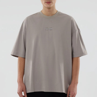 The model is wearing this New Era NEC Logo Oversized T-Shirt in Beige. 5