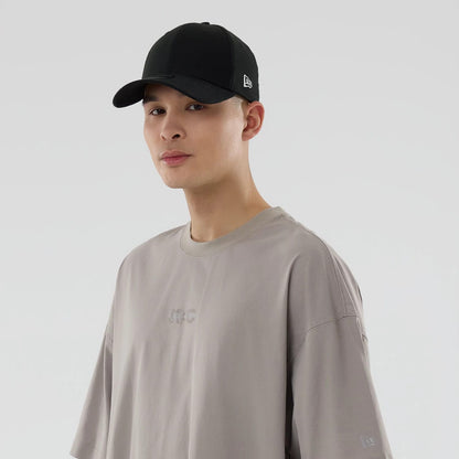 The model is wearing this New Era NEC Logo Oversized T-Shirt in Beige. 7