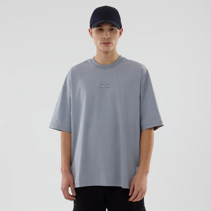 The model is wearing this New Era Urban Core Oversized T-Shirt in grey. 1