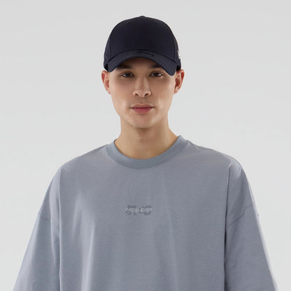 The model is wearing this New Era NEC Logo Oversized T-Shirt in grey. 6