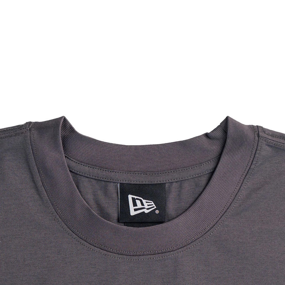 The model is wearing this New Era NEC Logo Oversized T-Shirt in black. 3