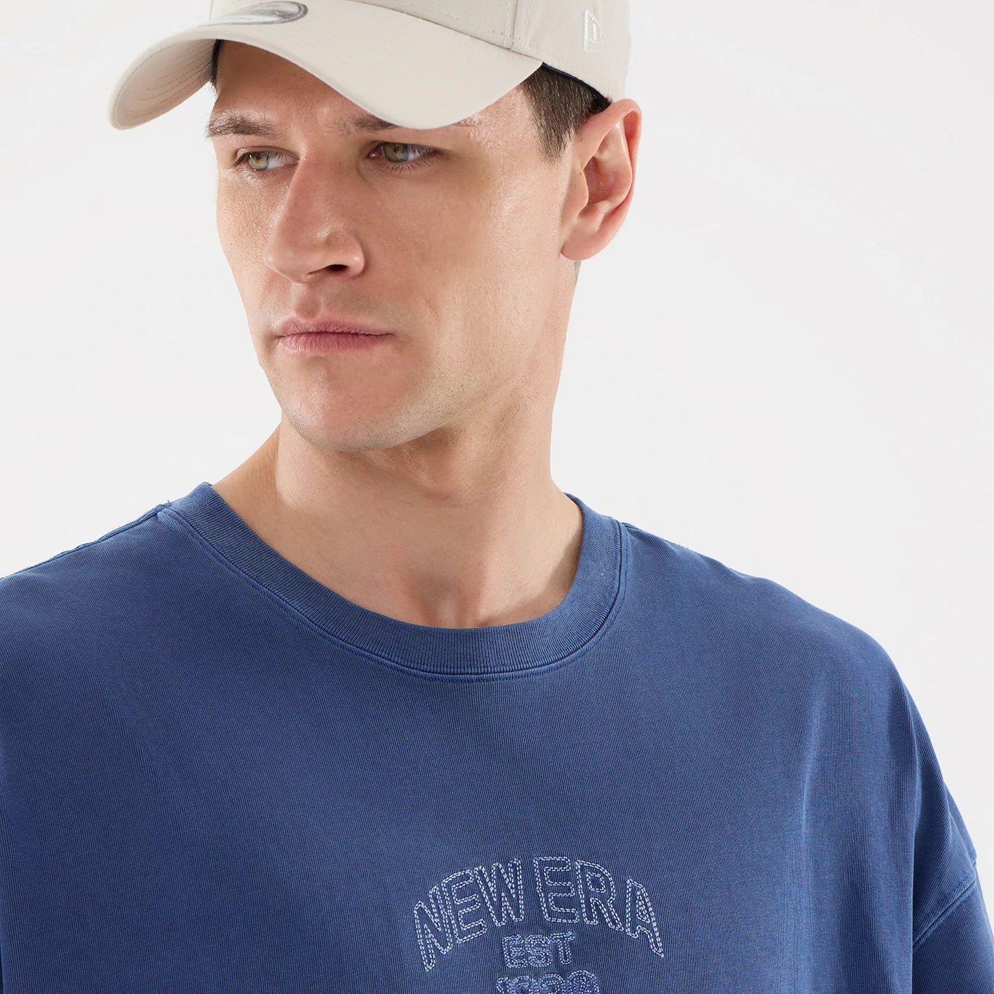 The model is wearing this New Era Street Archived Oversized T-Shirt in blue. 6
