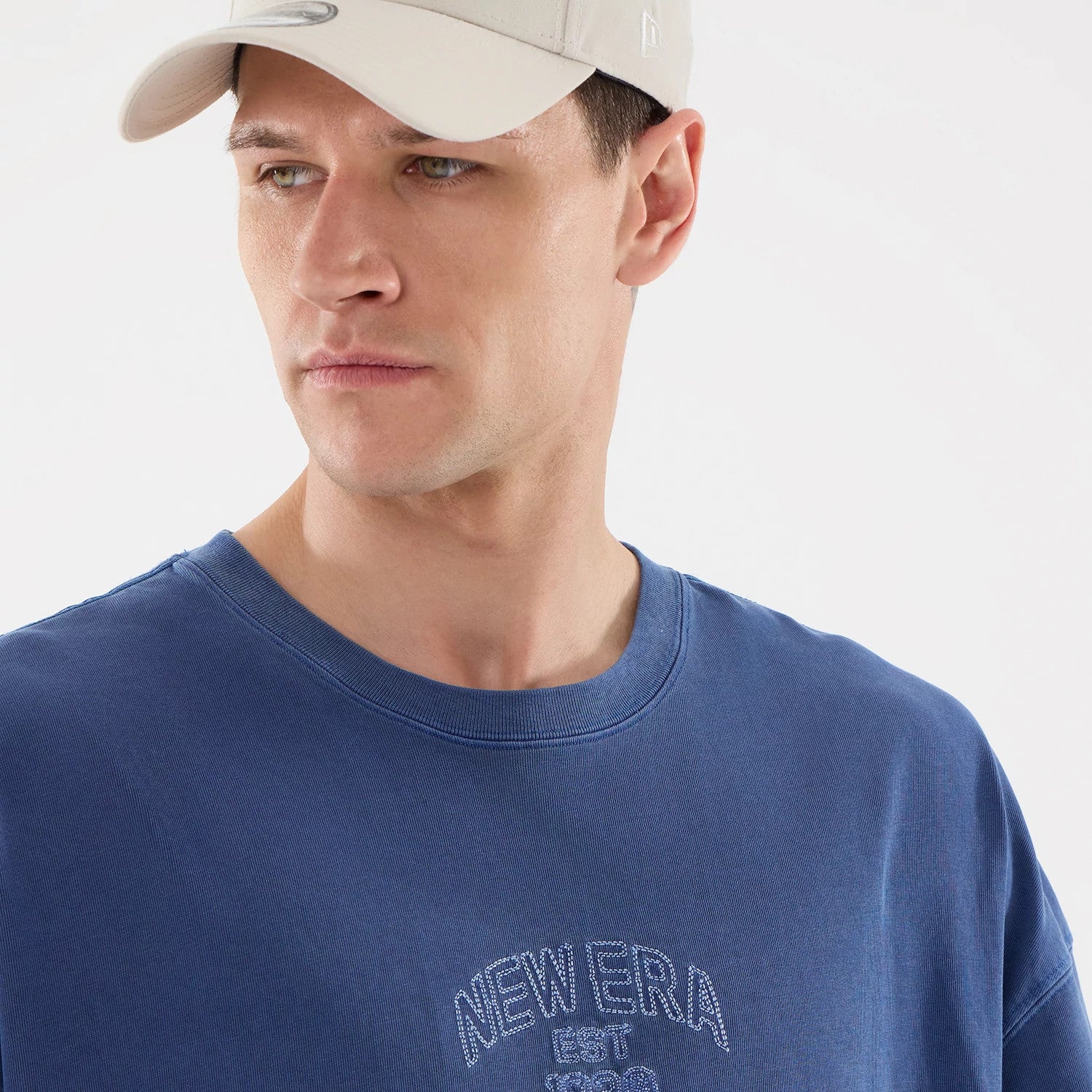 The model is wearing this New Era Street Archived Oversized T-Shirt in blue. 6