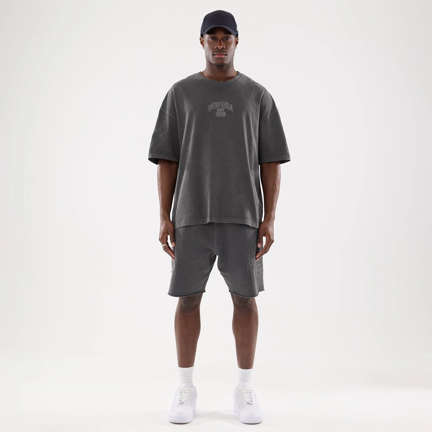 The model is wearing this New Era Street Archived Oversized T-Shirt in black. 8