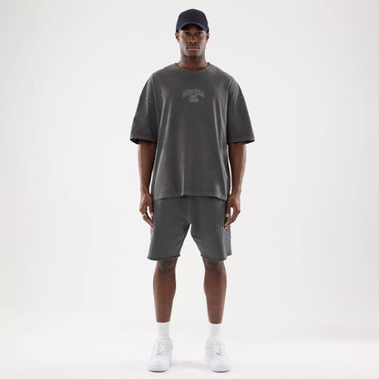The model is wearing this New Era Street Archived Oversized T-Shirt in black. 8