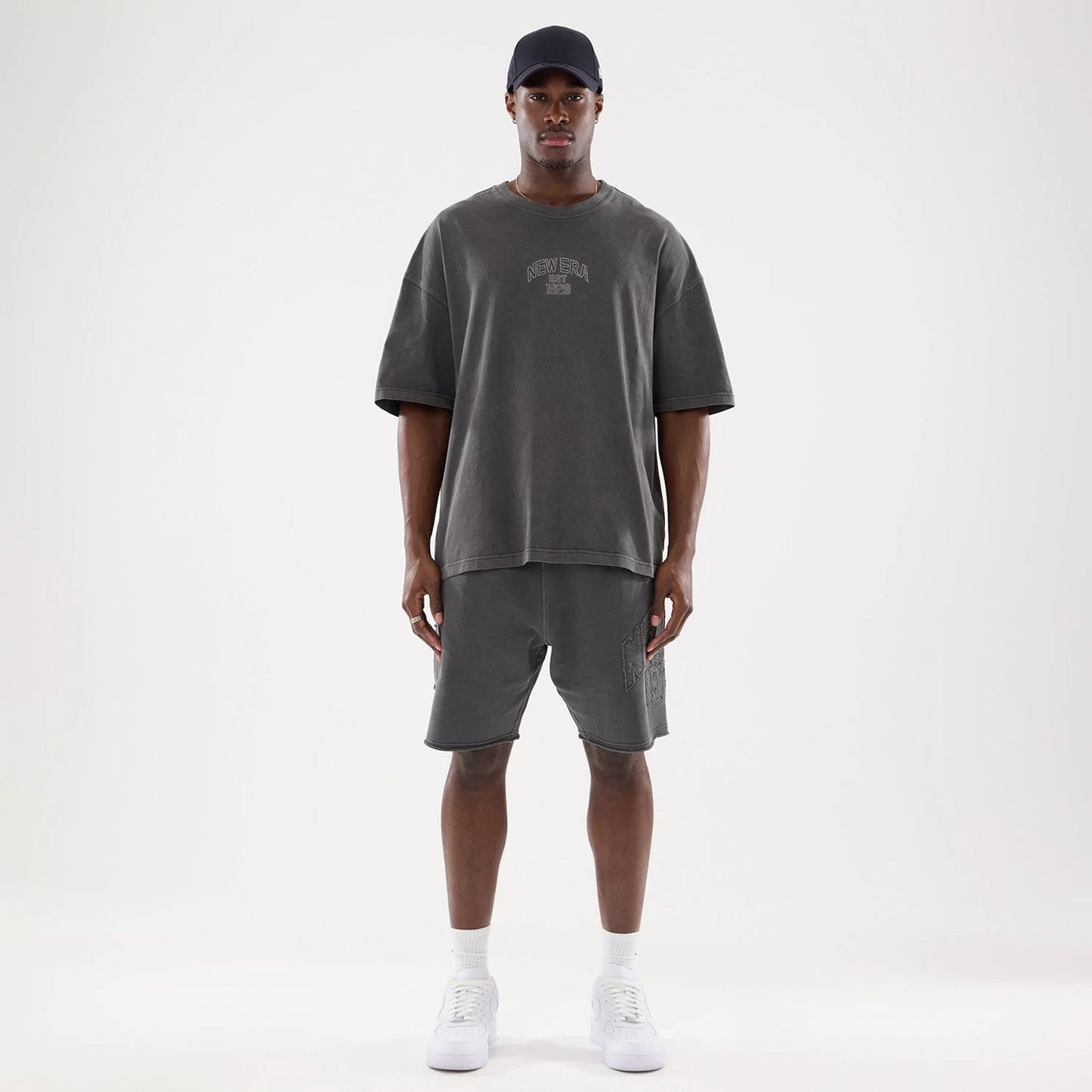 The model is wearing this New Era Street Archived Oversized T-Shirt in black. 8