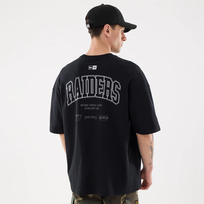 The model is wearing this NFL Raiders Wear Las Vegas Raiders Oversized T-Shirt in black. 2