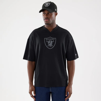 The model is wearing this NFL Raiders Wear Black Las Vegas Raiders Mesh Oversized T-Shirt in black. 1