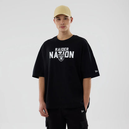 The model is wearing this NFL Rivalry Las Vegas Raiders Oversized T-Shirt in black. 1