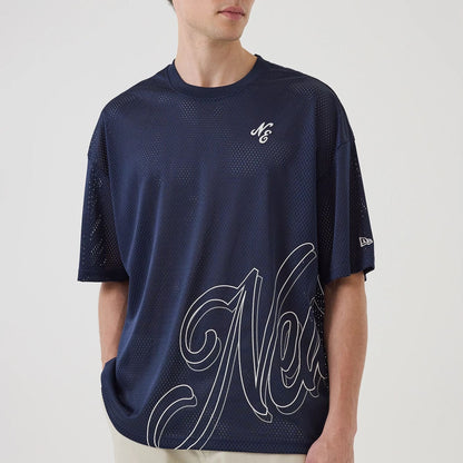 The model is wearing this New Era Mix League Oversized Mesh T-Shirt in blue. 6