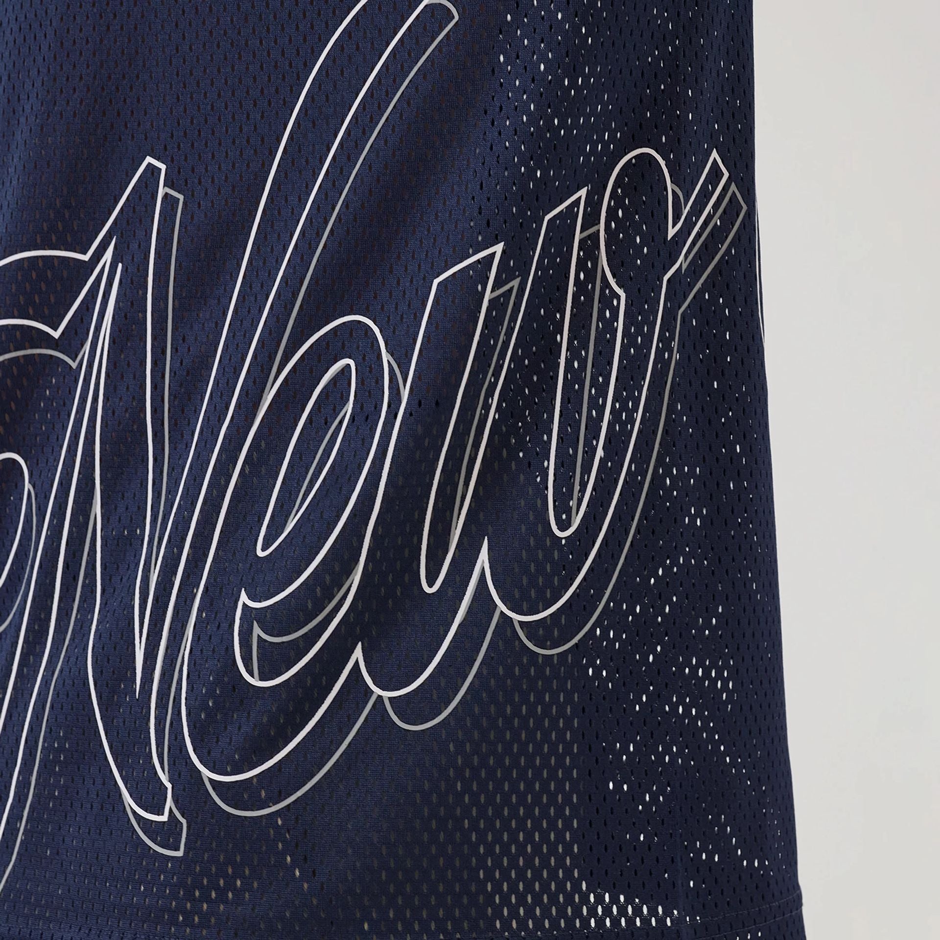 The model is wearing this New Era Mix League Oversized Mesh T-Shirt in blue. 4
