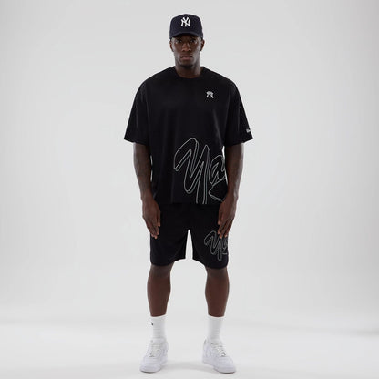 The model is wearing this MLB Mix League New York Yankees Oversized Mesh T-Shirt in black. 8