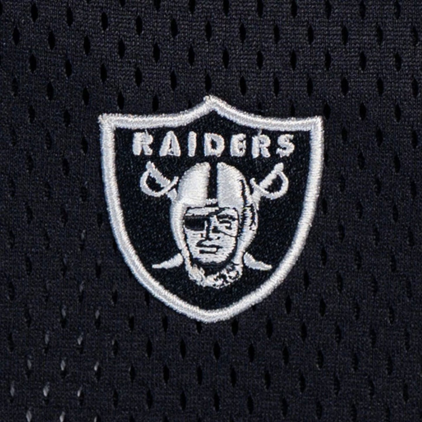 The model is wearing this NFL Mix League Las Vegas Raiders Oversized Mesh T-Shirt in black. 4