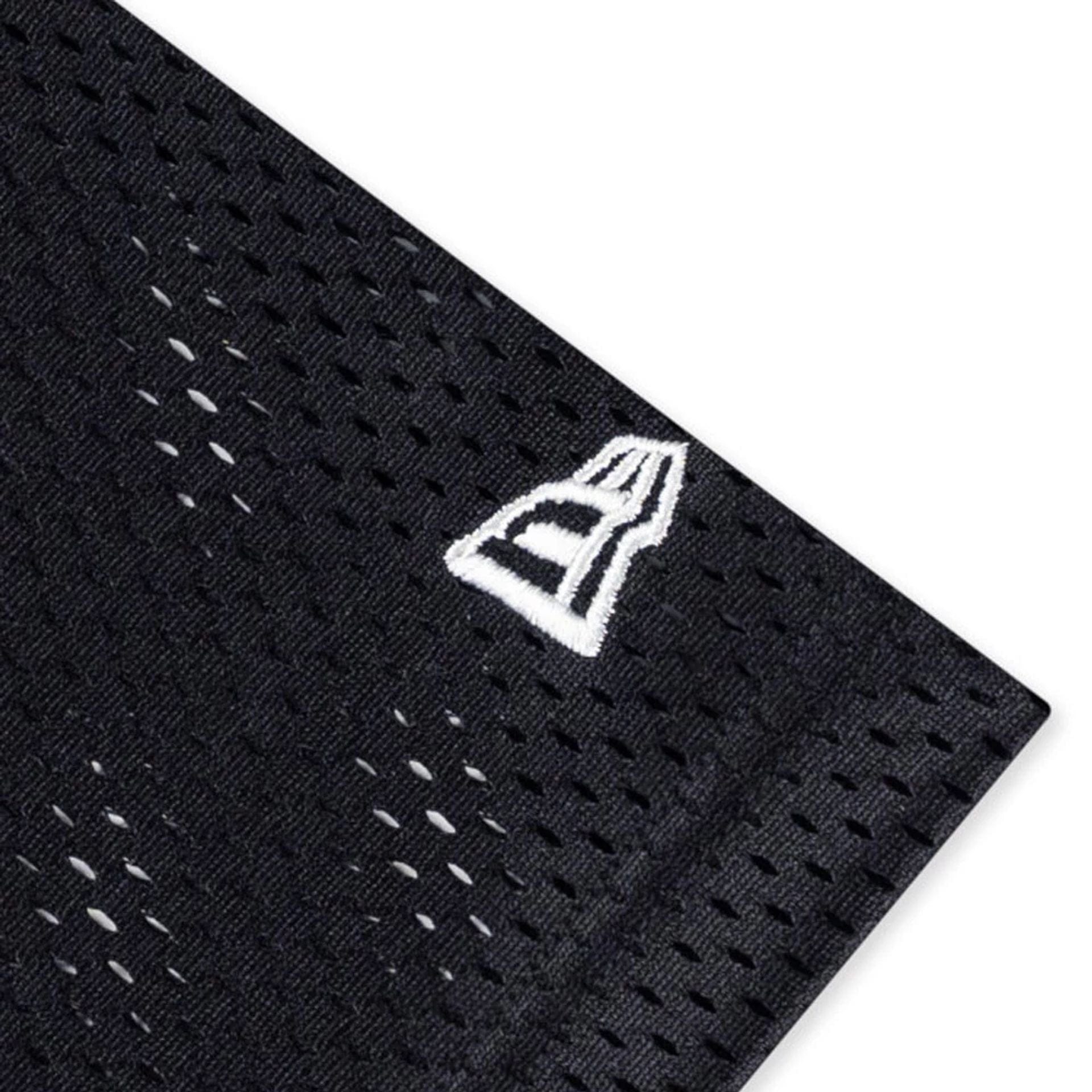 The model is wearing this NFL Mix League Las Vegas Raiders Oversized Mesh T-Shirt in black. 5