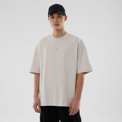 The model is wearing this New Era Skate Is Life Graphic Oversized T-Shirt in Cream. 1