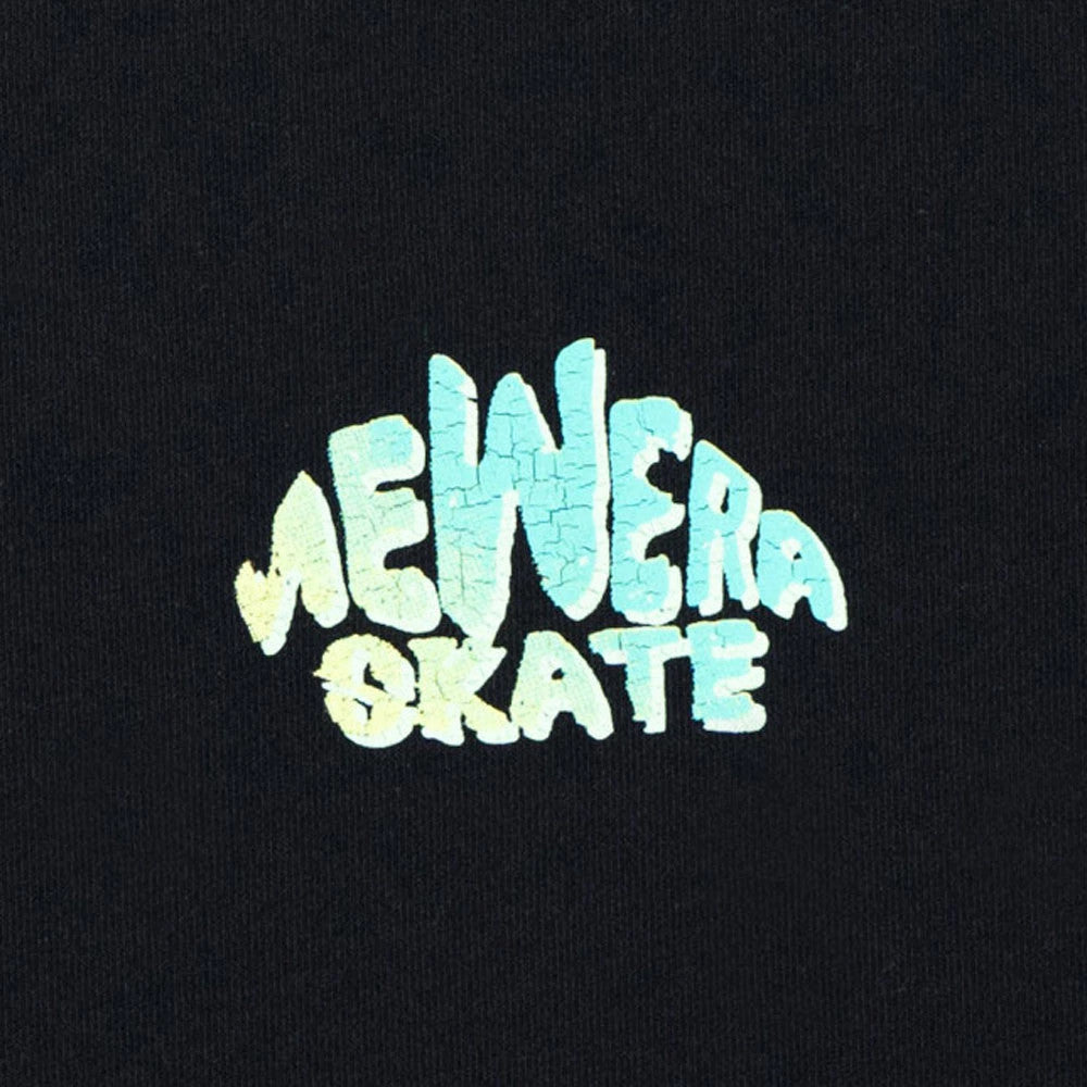 The model is wearing this New Era Skate Is Life Graphic Oversized T-Shirt in black. 2