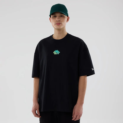 The model is wearing this New Era Skate Is Life Graphic Oversized T-Shirt in black. 1