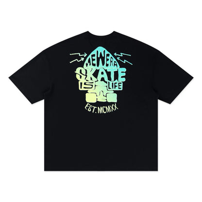 The model is wearing this New Era Skate Is Life Graphic Oversized T-Shirt in black. 7