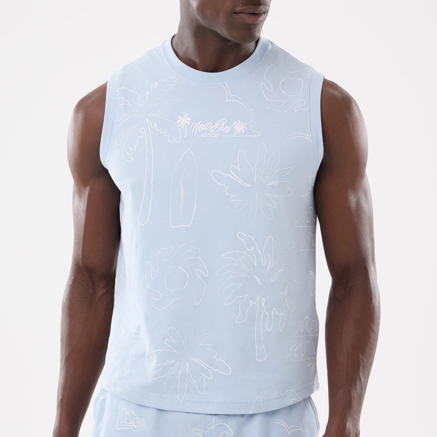 The model is wearing this New Era Resort Tank Top in blue. 3