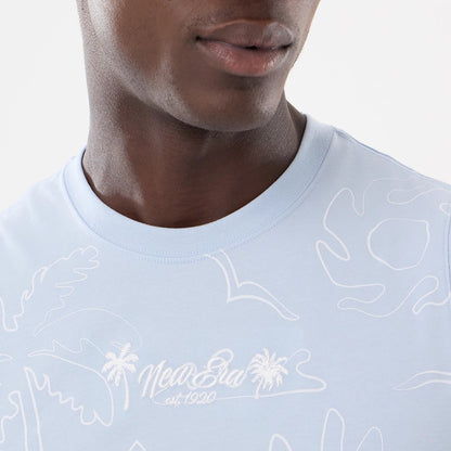 New Era Resort Blue Tank Top, close-up on a model featuring white embroidered New Era est. 1920 lettering with palm tree design on the chest, and light blue fabric with abstract white patterns.