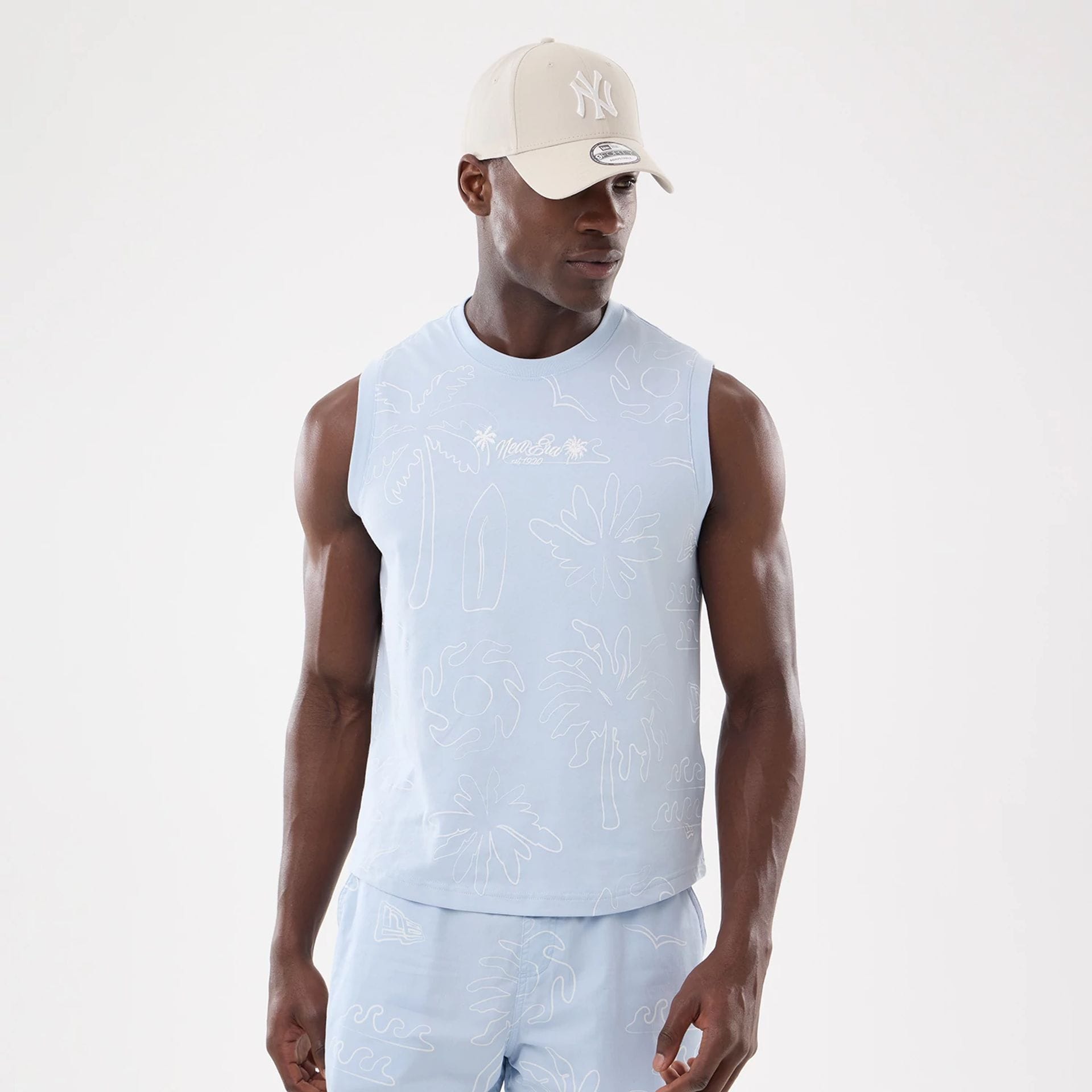 The model is wearing this New Era Resort Tank Top in blue. 1