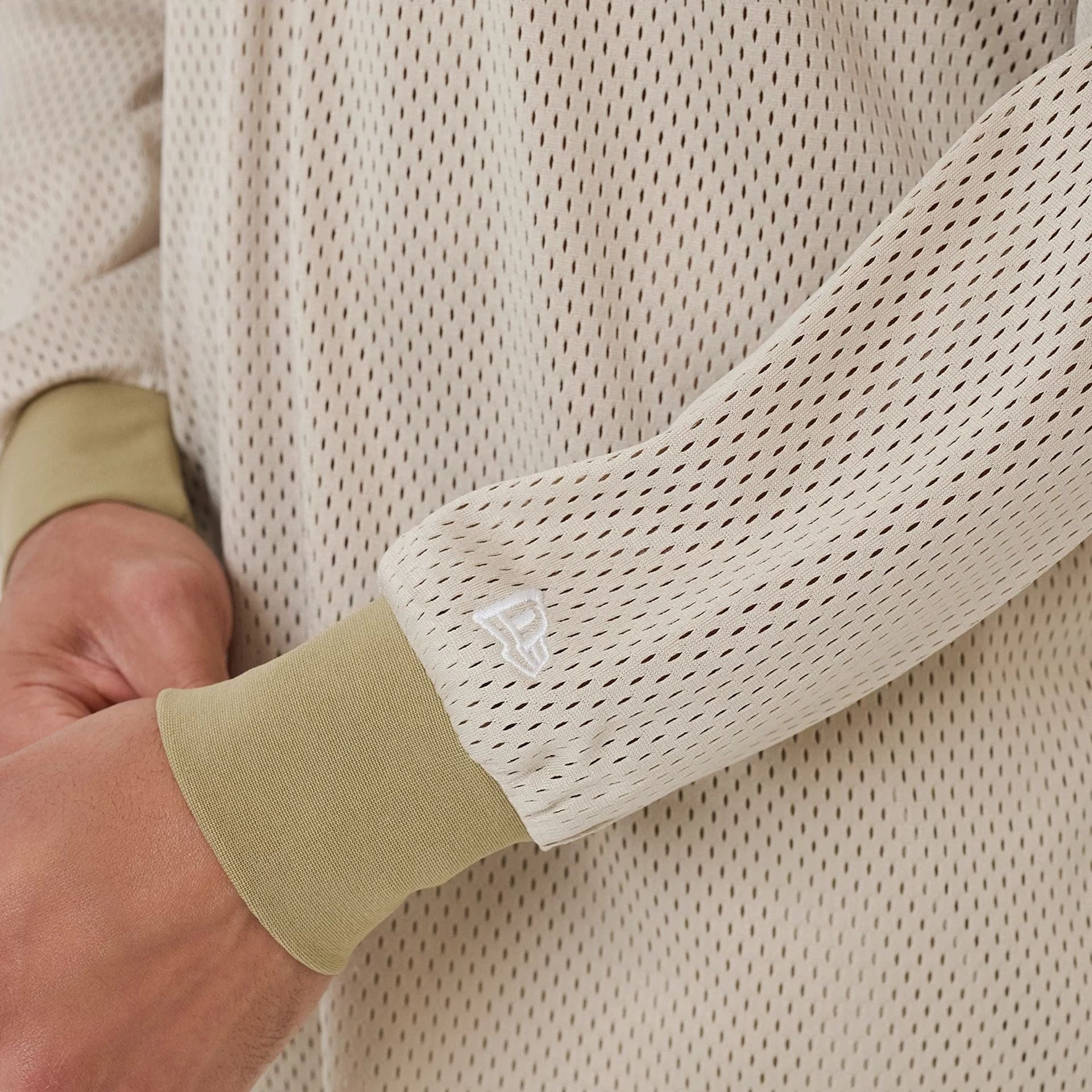 The model is wearing this New Era Urban Core Long Sleeve Jersey in beige/khaki. 6